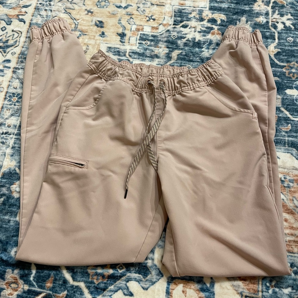Pink jaanuu jogger scrub bottoms in size small tall. Hardly worn